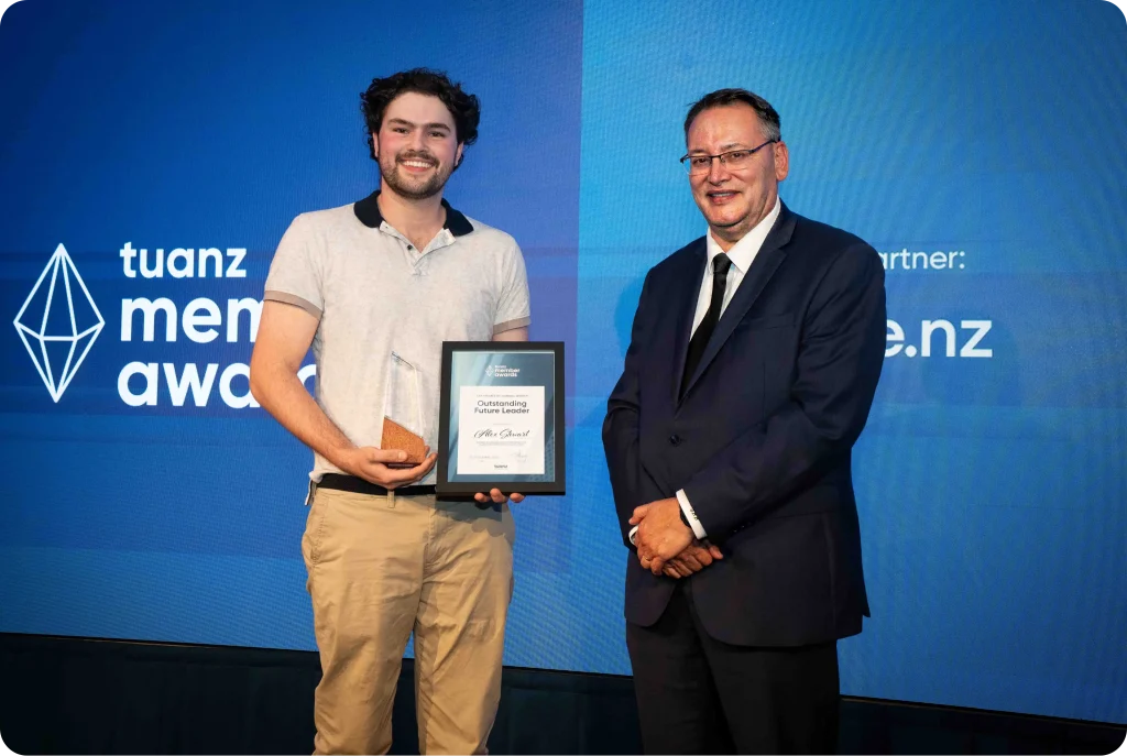Award ceremony with two individuals.