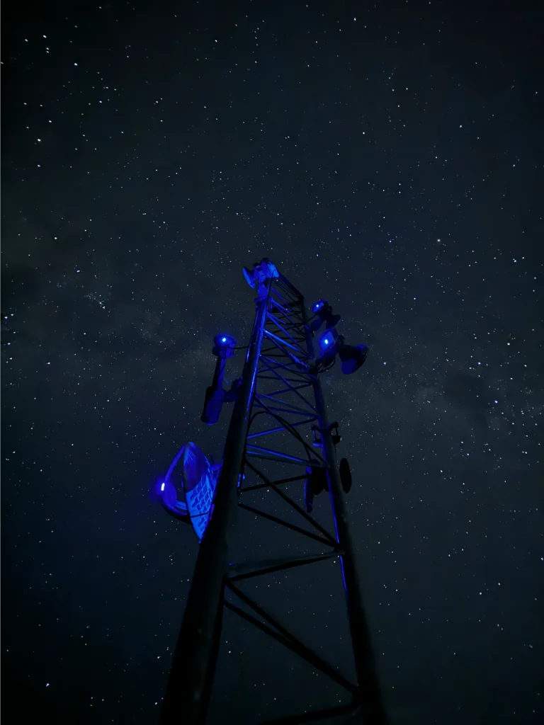 WombatNET tower under a starry night sky